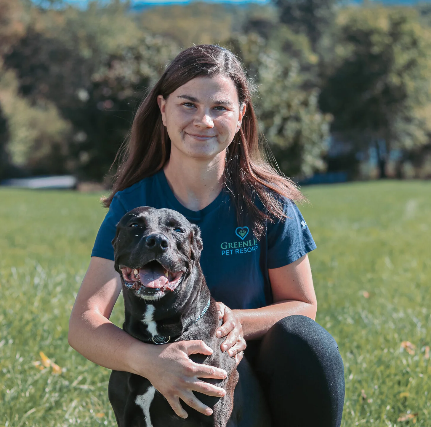 Greenlin dog trainer sitting with dog